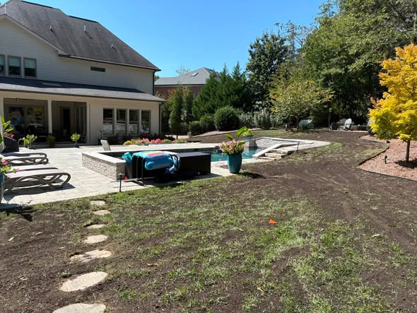 The same lawn once seeded, with new fescue starting to come through in Willow Spring, NC.